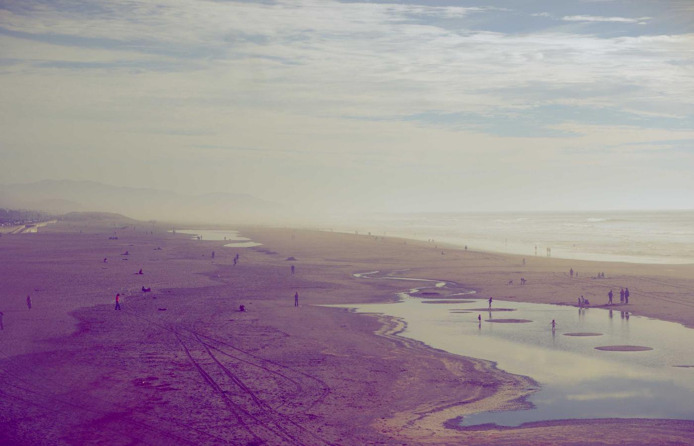 Home roof with a grid-tied solar array under clear sky